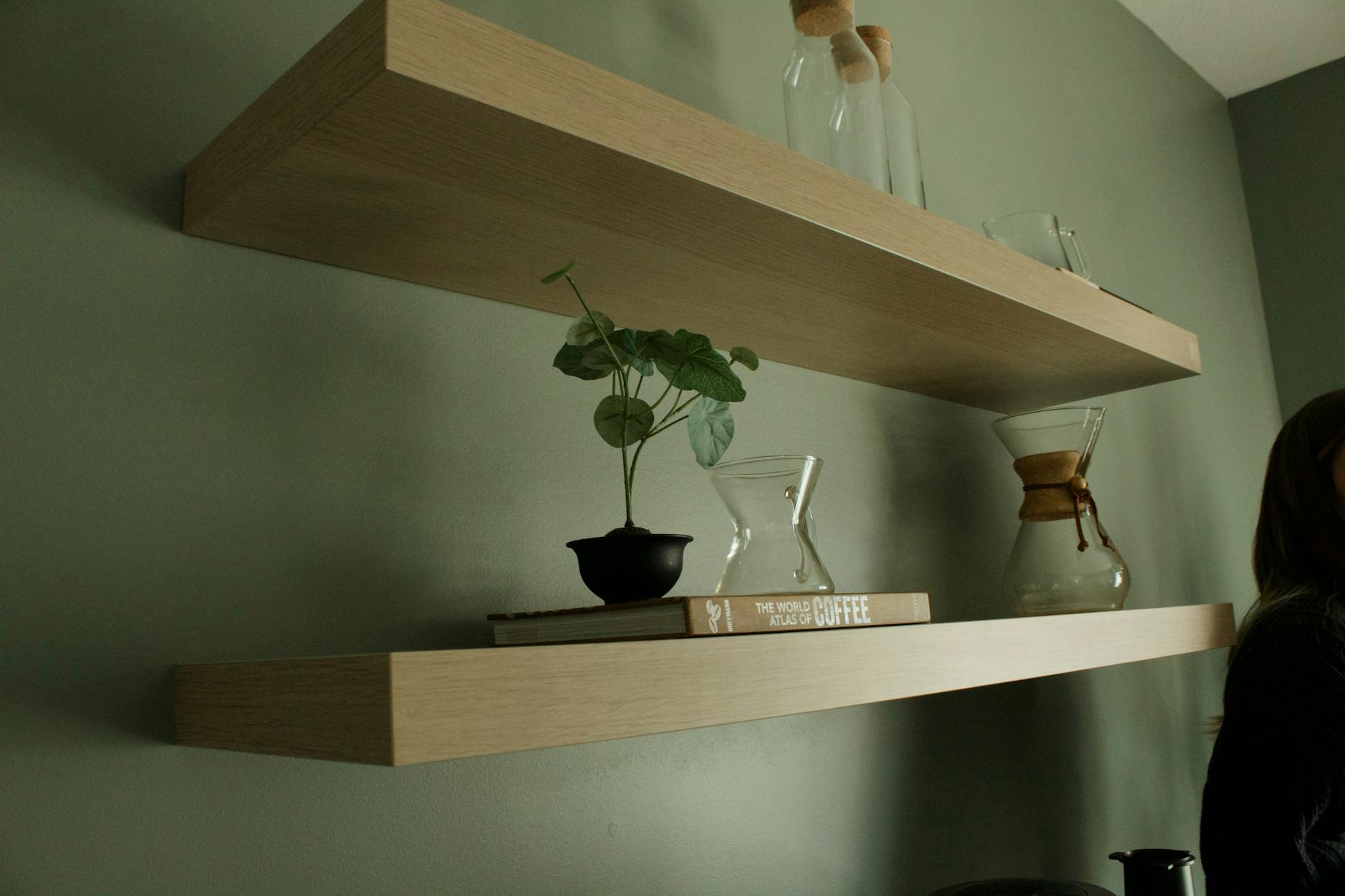 A clean, stylish minimalist floating shelf in a modern setting.
