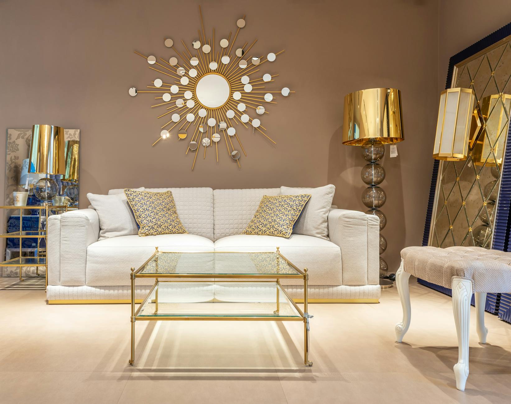 Example of modern gold decor for living room table with a stylish lamp.