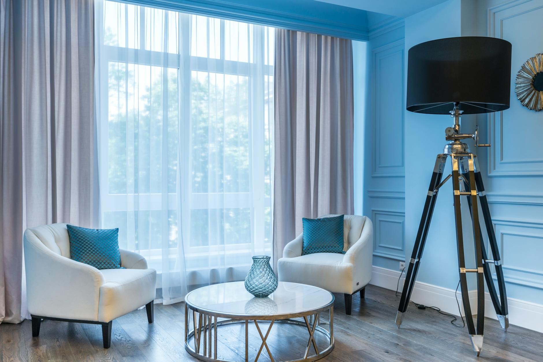 Beautiful Styling with Rose Gold Tripod Floor Lamp 5 A stylish rose gold tripod floor lamp in a cozy living room setting.